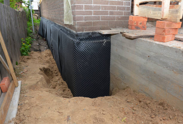 SJ Waterproofing Pros technician performing targeted Emergency Waterproofing assessment in Glouster, OH